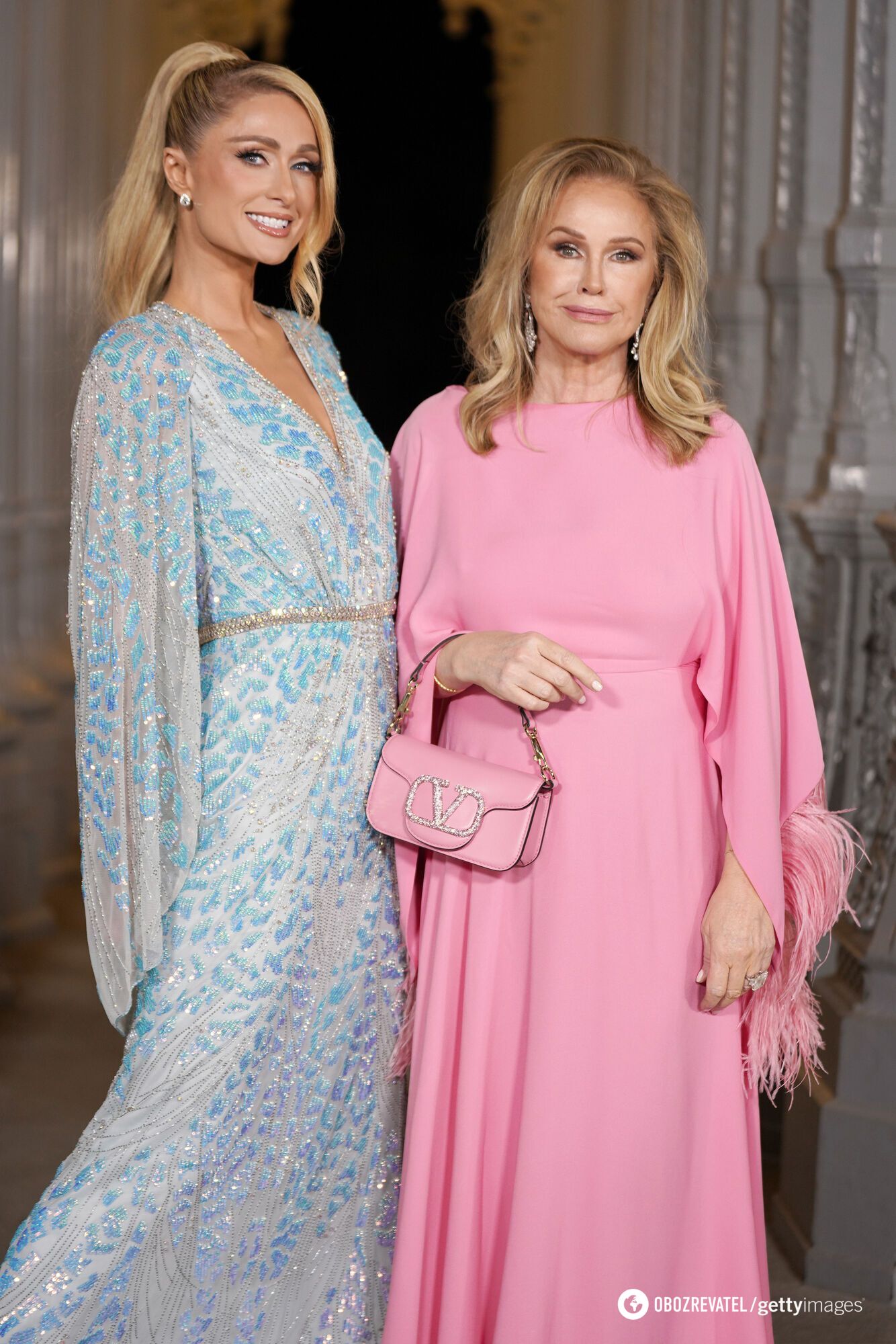 ''Oh God, the neck! Did they ever hold babies before?!'' Paris Hilton and her mother, Kathy Hilton, faced criticism over a video featuring the newborn Phoenix