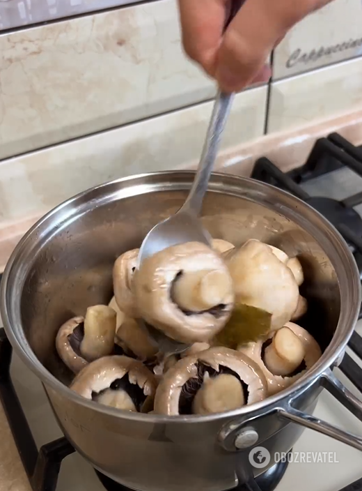 Putting mushrooms in the marinade