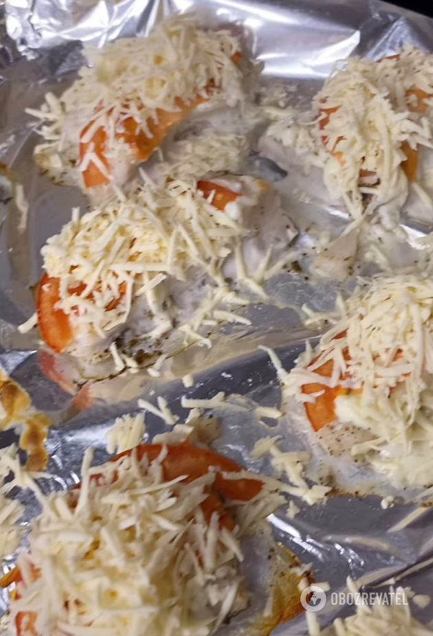 Cooked fish with tomato and cheese