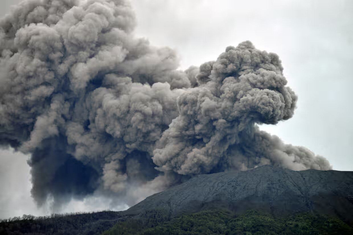 A volcanic eruption in Indonesia killed 11 climbers and covered several villages with ash. Photos and videos