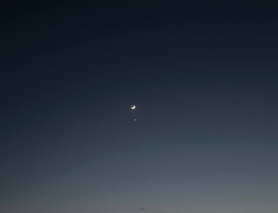 The Moon and Venus in the evening sky.