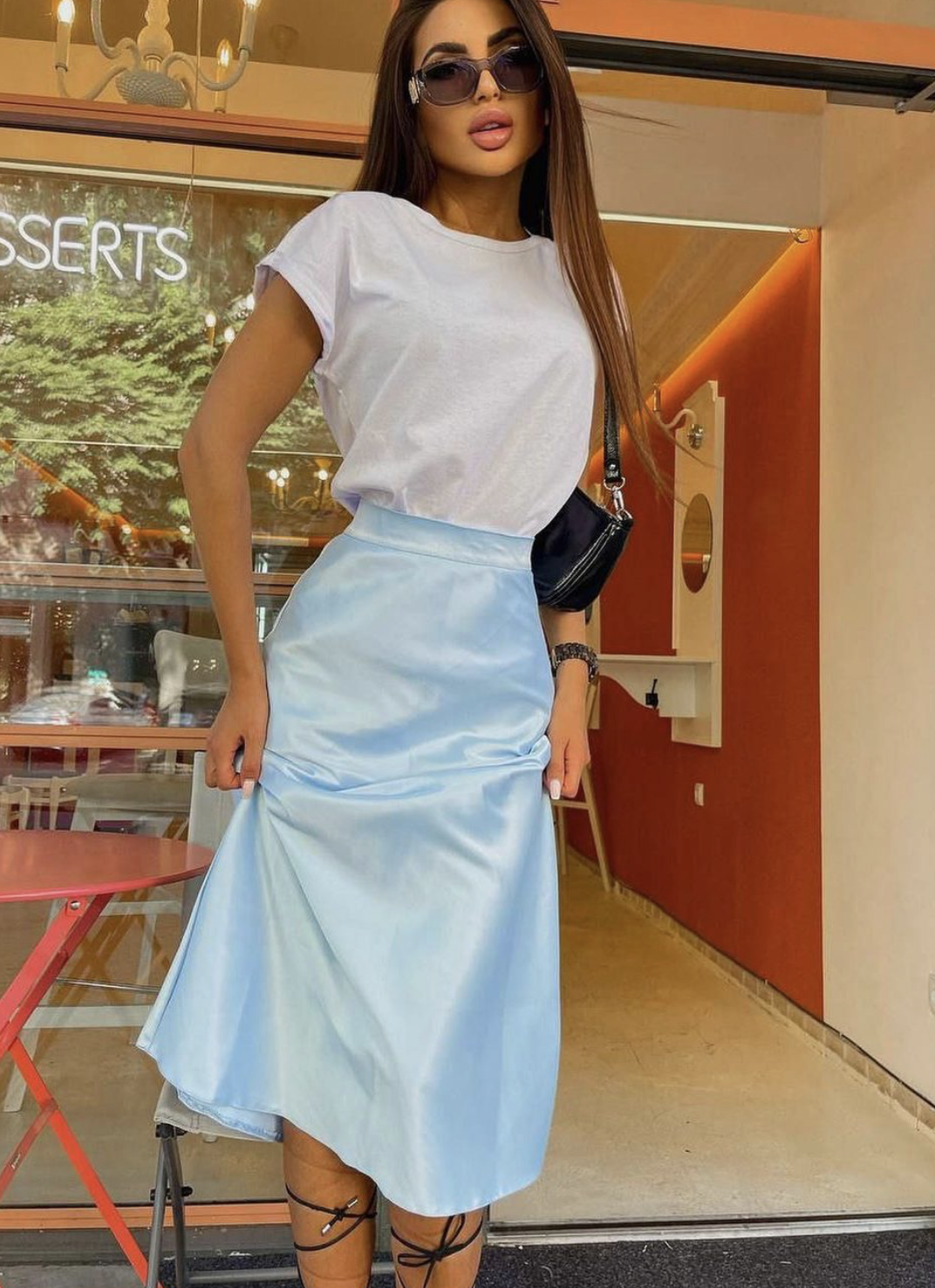 A classic T-shirt and midi skirt is a great look.
