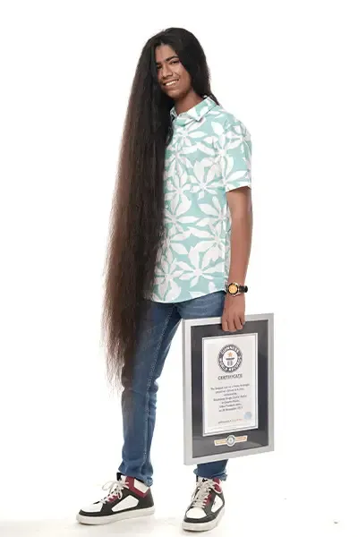 What a 15-year-old boy with the world's longest hair looks like and what the record holder among girls did with her ''wealth''. Photo.
