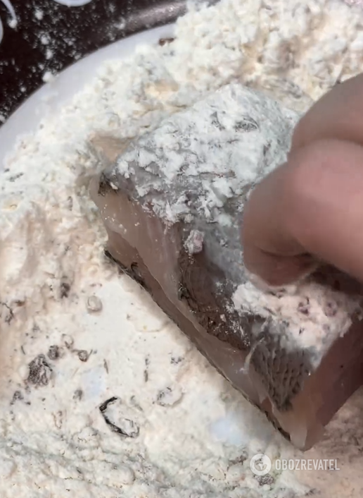 Dipping hake in flour