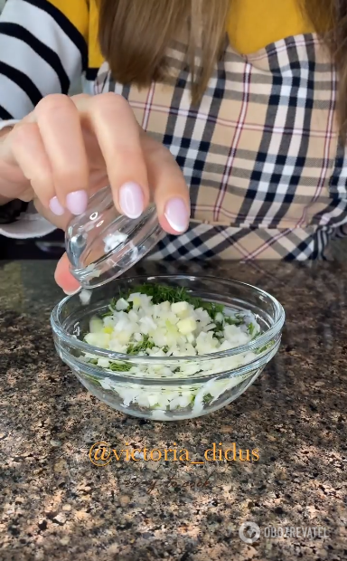 Adding chopped garlic to greens