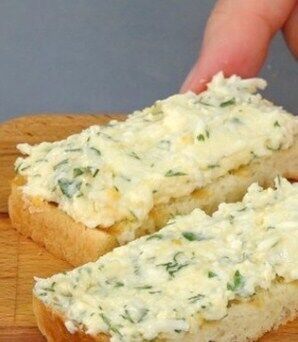 Spread with melted cheese and herbs