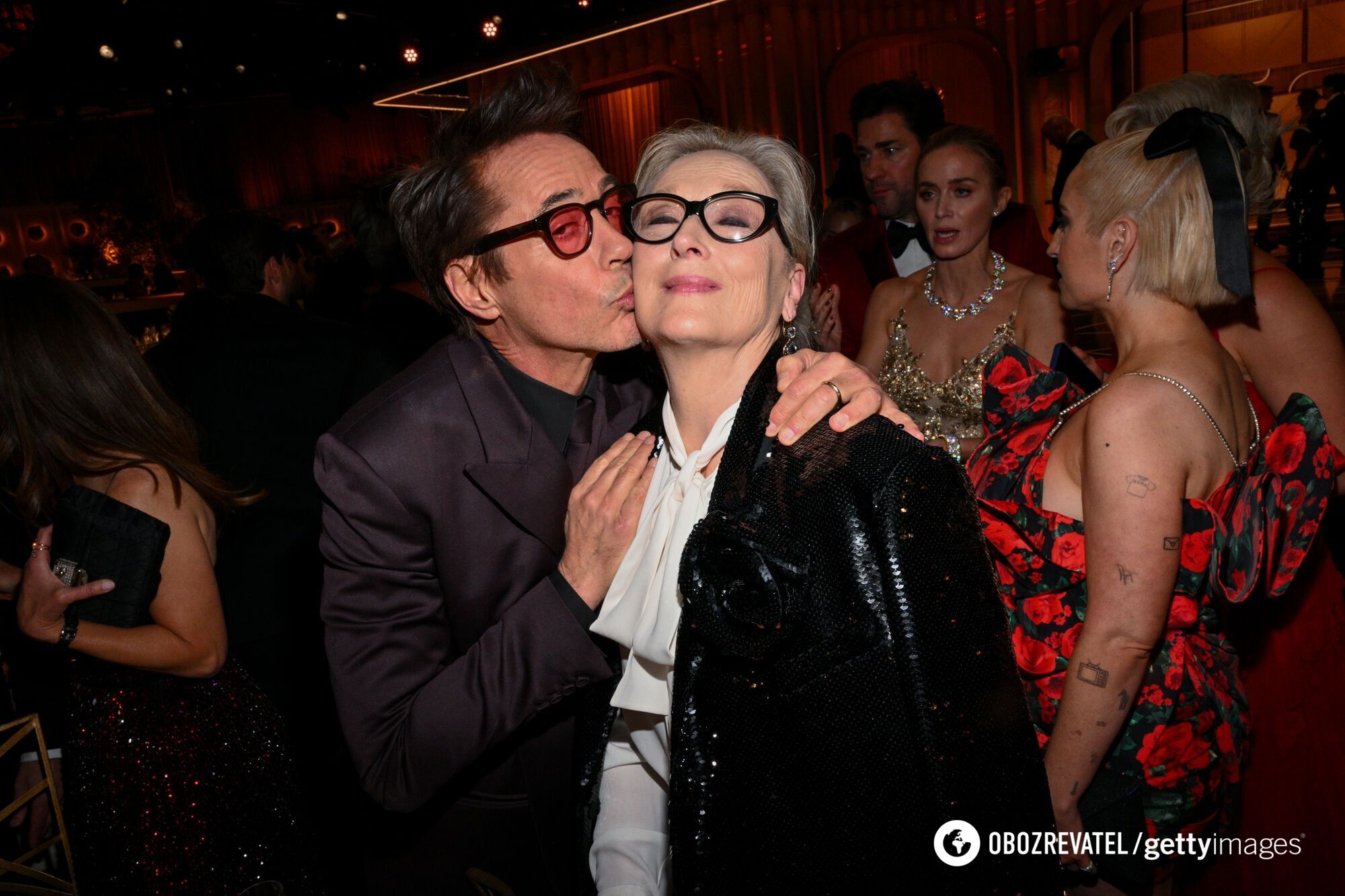 At the Golden Globes, everyone wanted a photo with Meryl Streep, including Robert Downey Jr.