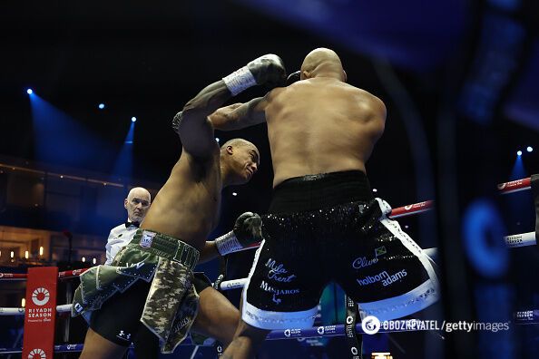 The undefeated heavyweight won the championship fight by knockout in the first round, hanging his opponent on the ropes. Video.