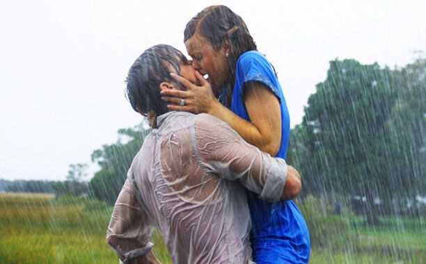 A couple in love kissing in the rain