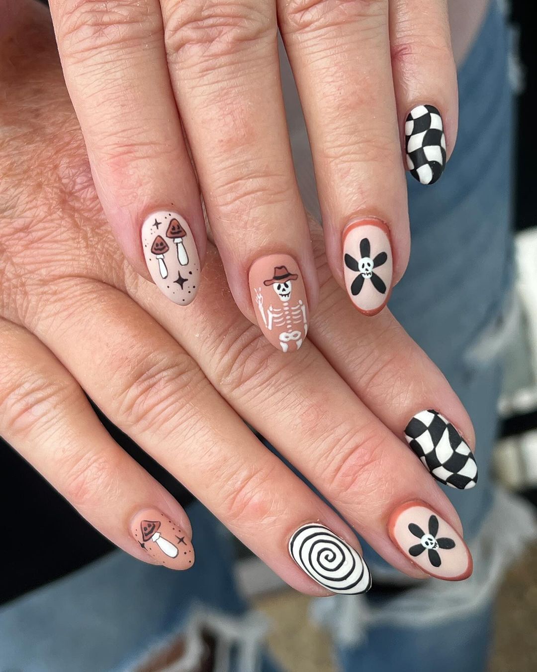 From a witch woman to a mummy and a cowboy skeleton. 10 super stylish Halloween manicure ideas