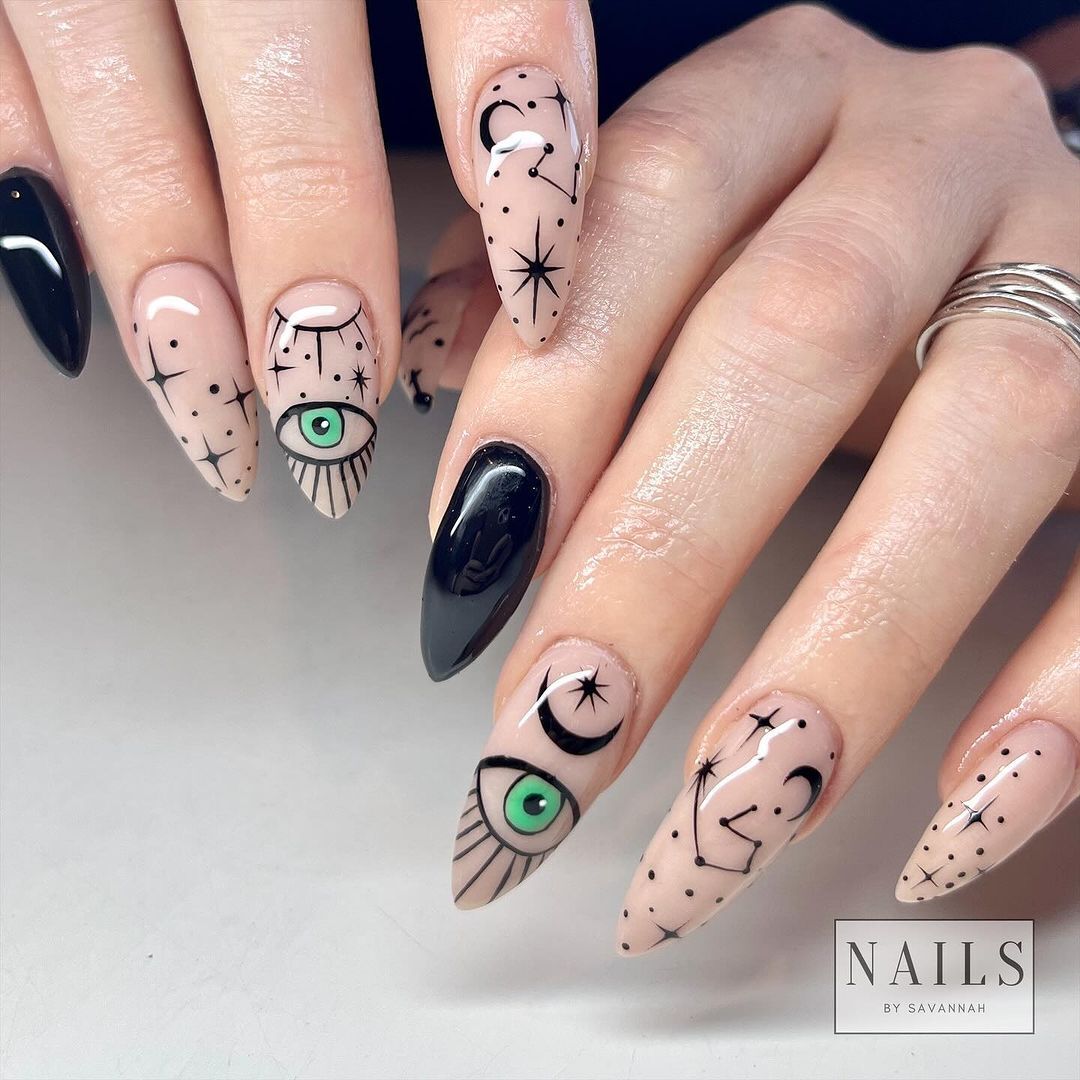 From a witch woman to a mummy and a cowboy skeleton. 10 super stylish Halloween manicure ideas