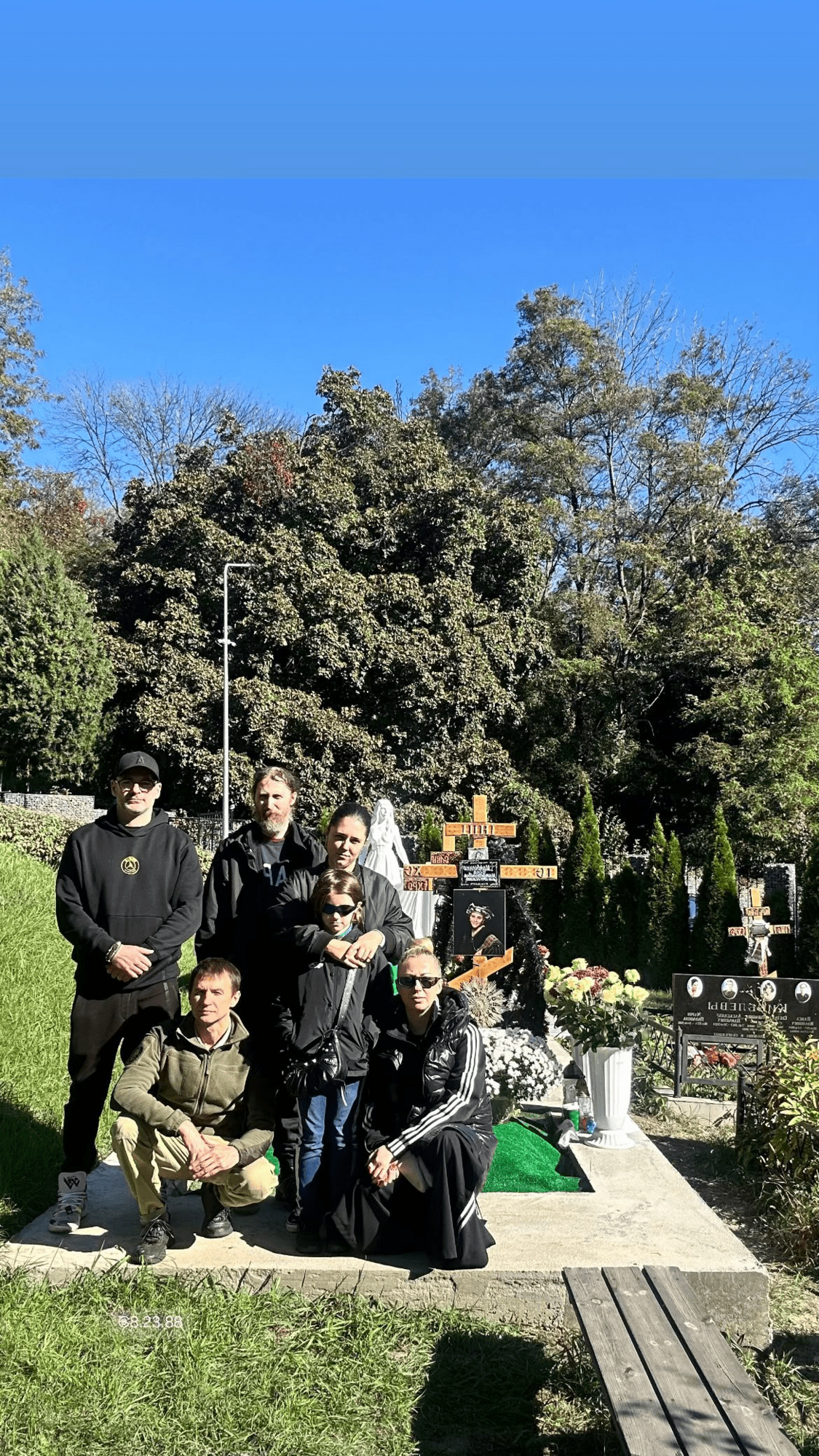 At their mother's grave: Tonia Matvienko shows rare photo with brothers who rarely appear in public