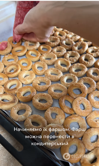 Putting bagels on a baking sheet