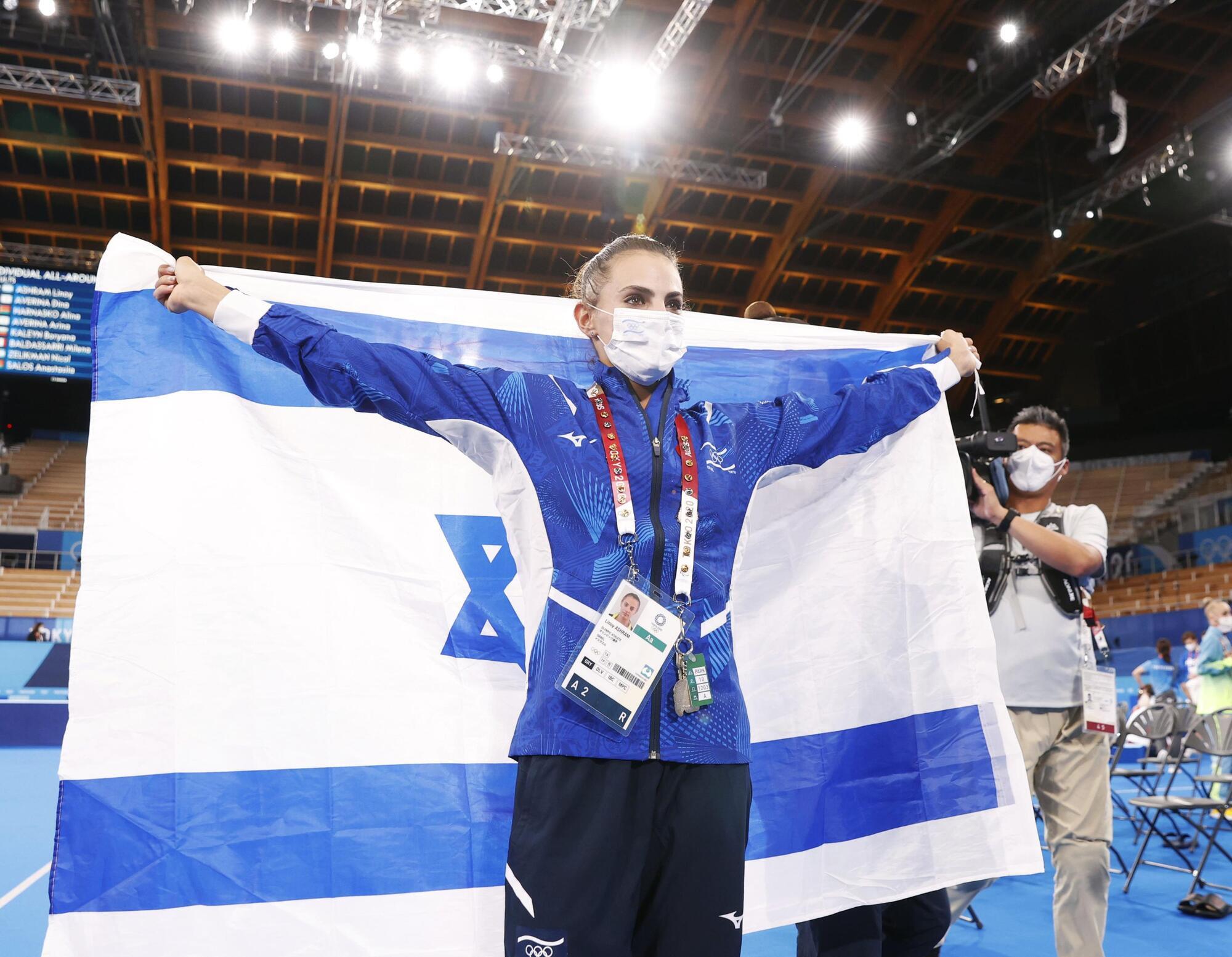 Lina Ashram with the flag of Israel.