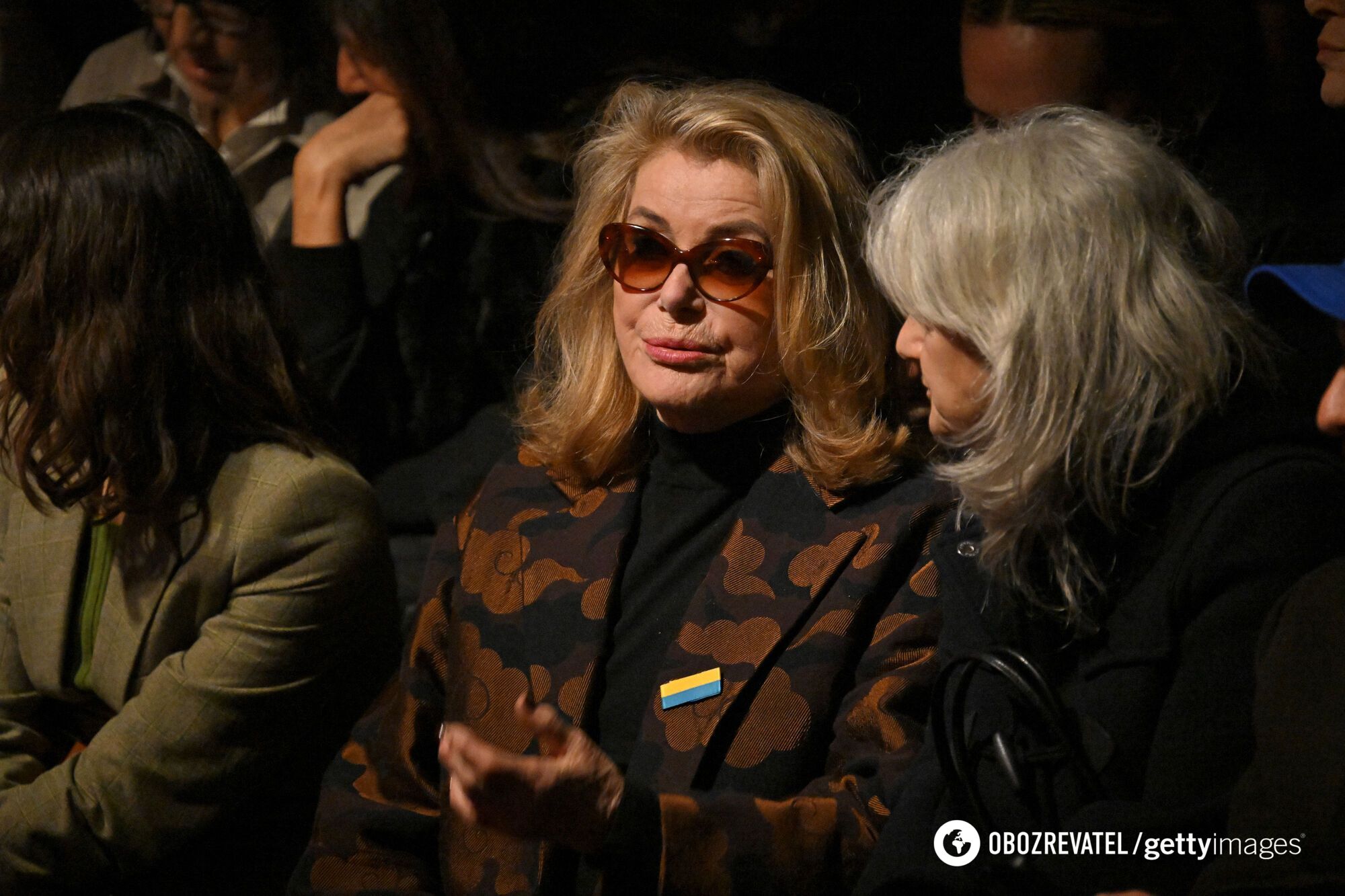 French movie star Catherine Deneuve got into an embarrassment for supporting Ukraine at Paris Fashion Week, but quickly made amends. Photos