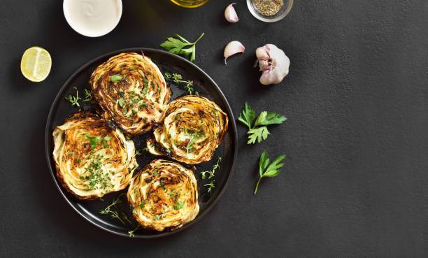 Baked young cabbage with spices in the oven