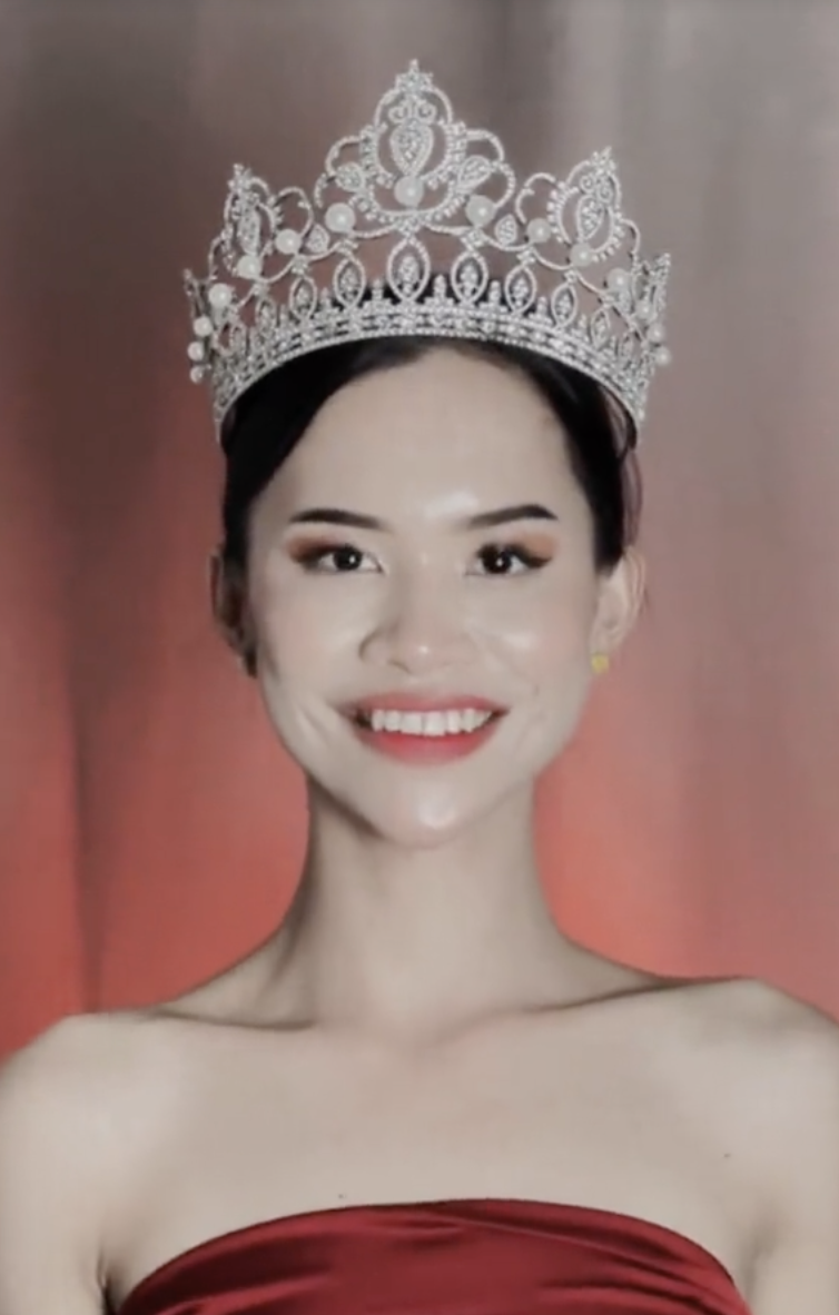 Malaysia's beauty queen was stripped of her title for ''wild dancing'' with half-naked men in Thailand. Photo.