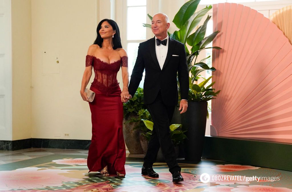Lady in red. The bride of the richest man in the world stunned the audience with a $2200 corset dress