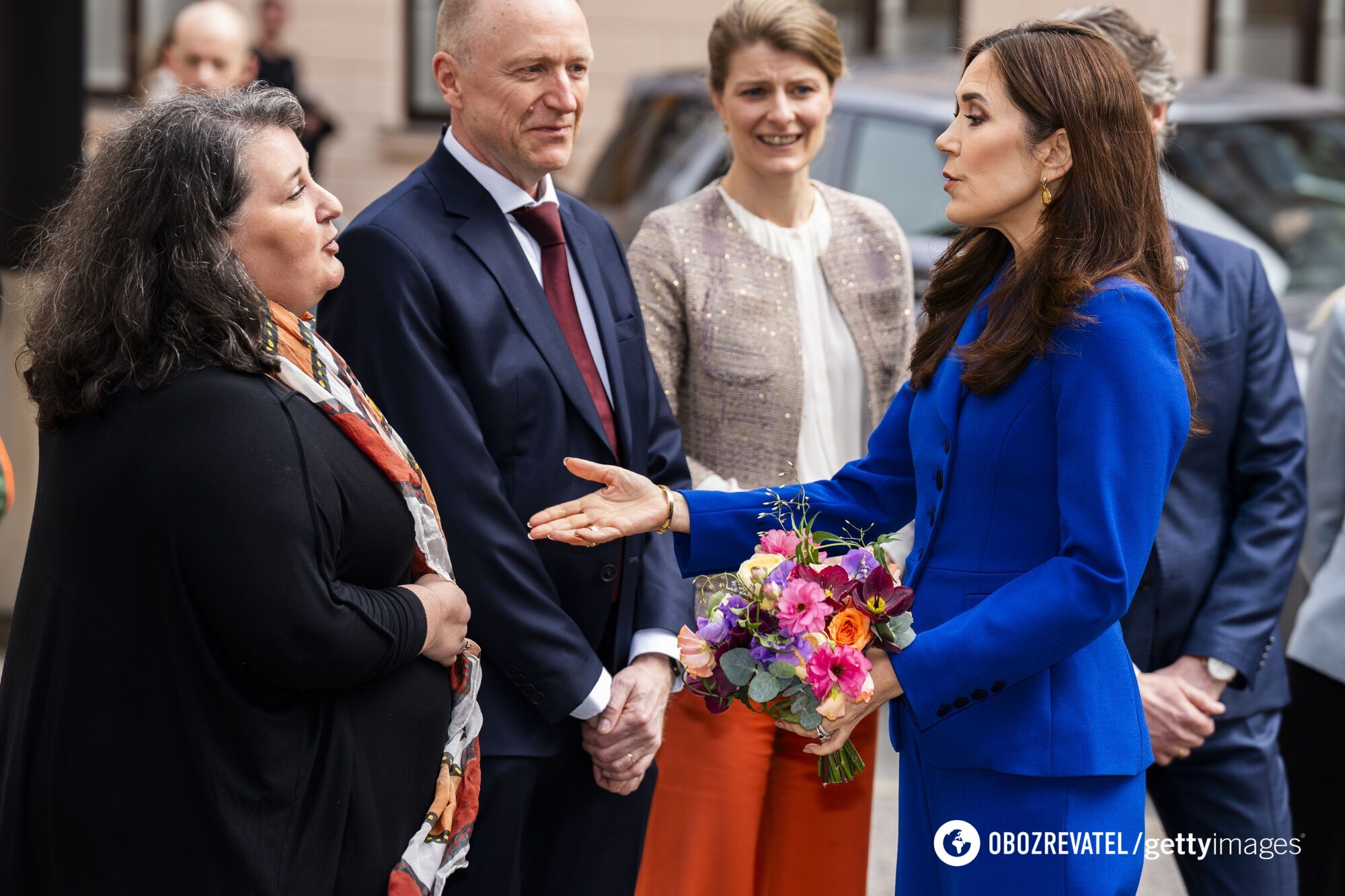 The Queen of Denmark in a cobalt-colored suit broke her own fashion rule. Photo