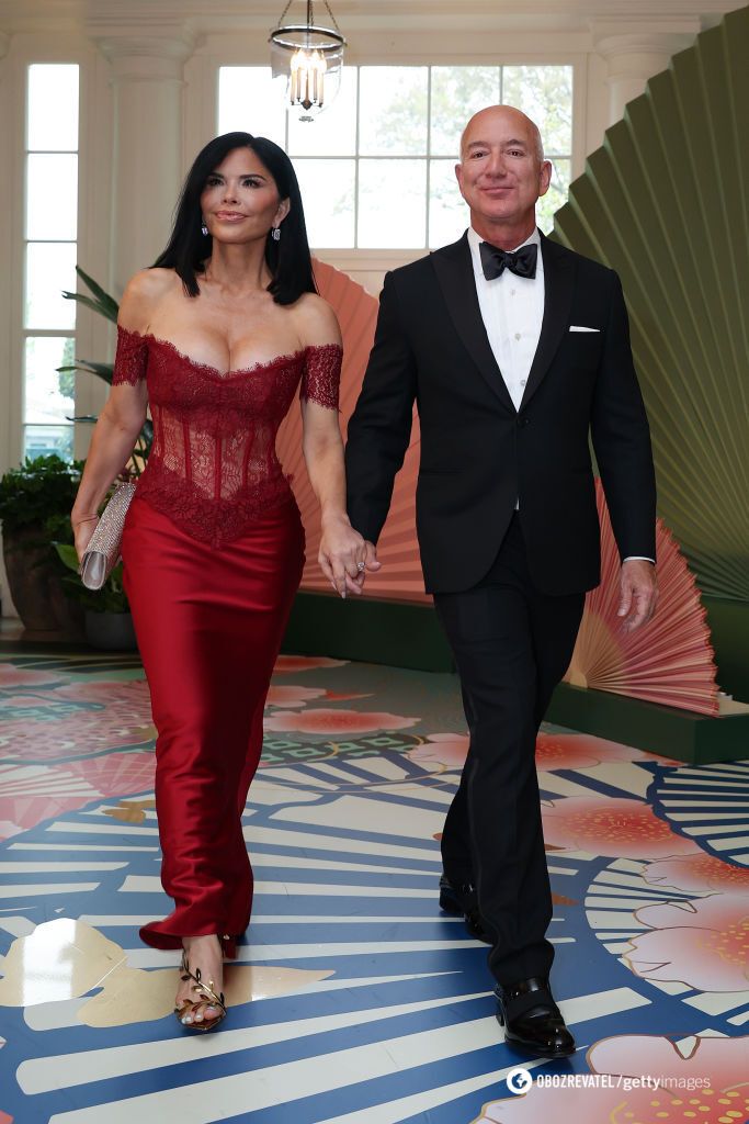 Lady in red. The bride of the richest man in the world stunned the audience with a $2200 corset dress