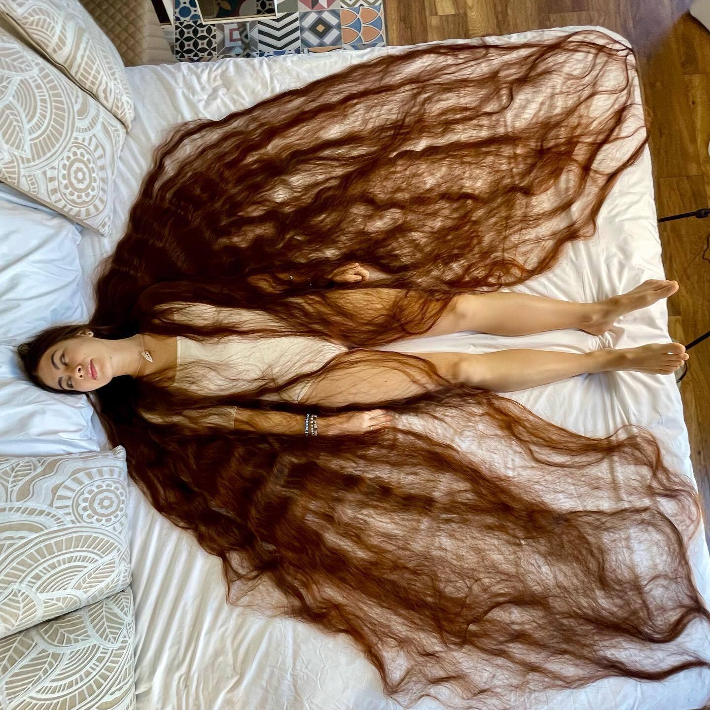 A Ukrainian woman entered the Guinness Book of World Records as the owner of the world's longest hair: what does Rapunzel Aliya Nasirova look like?