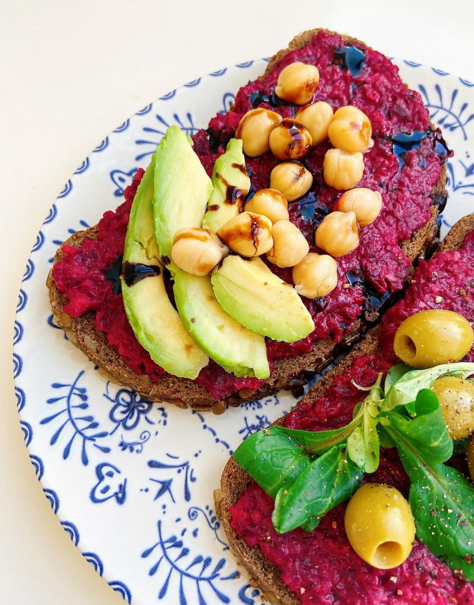 Spread on a sandwich with beets, chickpeas, and tahini.
