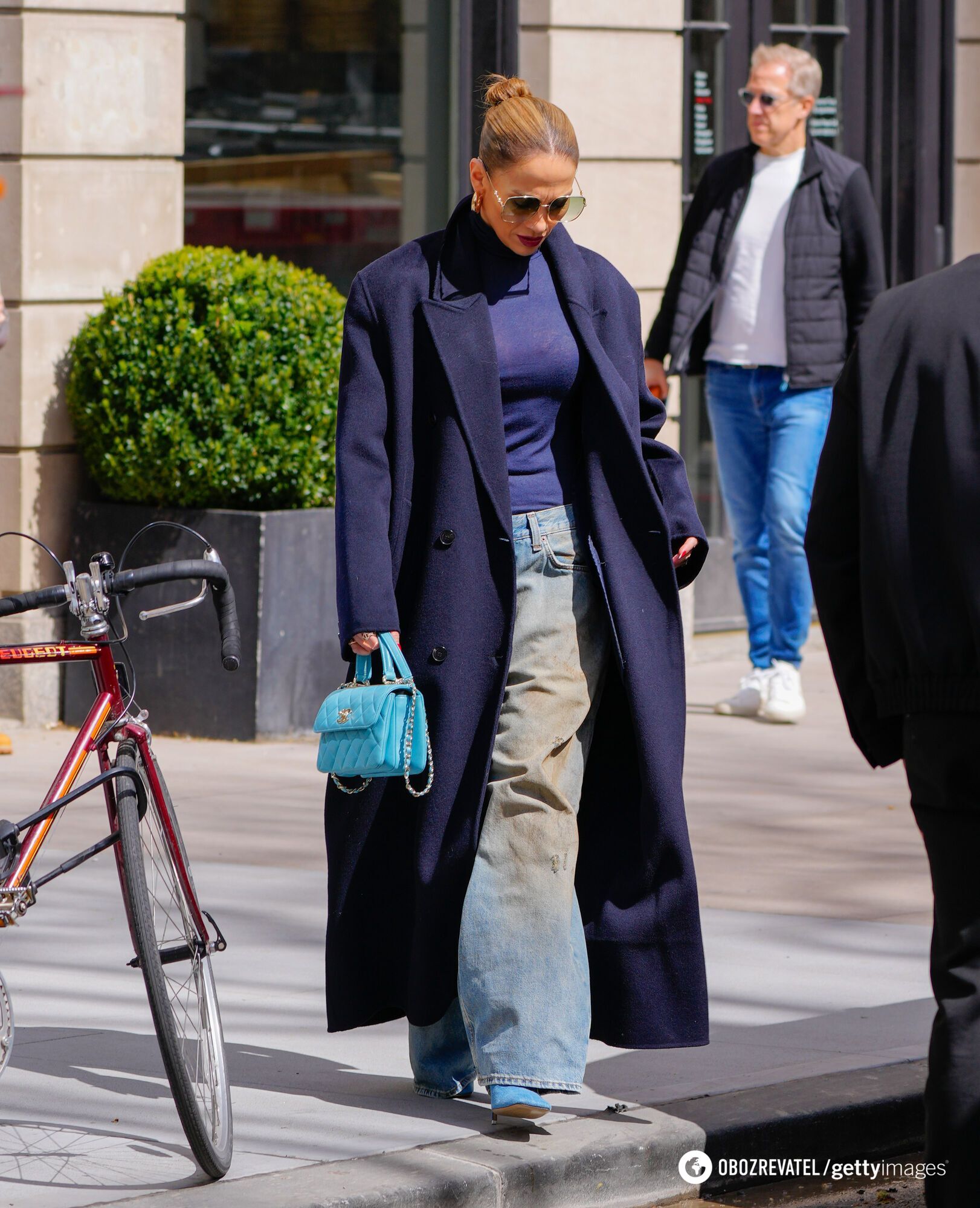 Jennifer Lopez joins the ''dirty denim'' trend of the 90s, showing off popular jeans