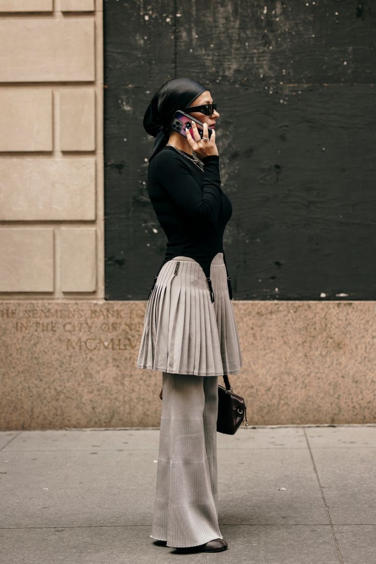 An unexpected combo of the season. How to wear pants and a skirt without looking old-fashioned