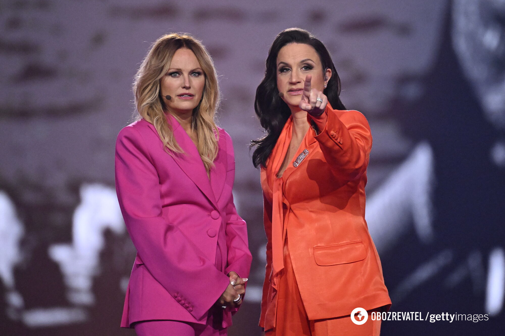 The hosts of Eurovision 2024 chose pantsuits in the colors of the stage. Photo