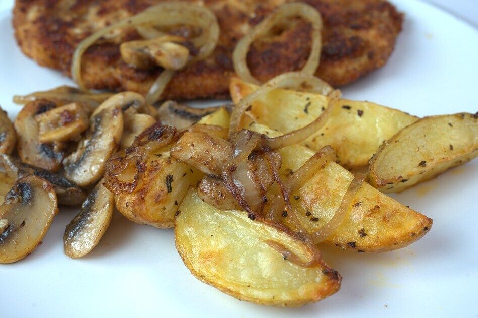 Fried potatoes with mushrooms and onions