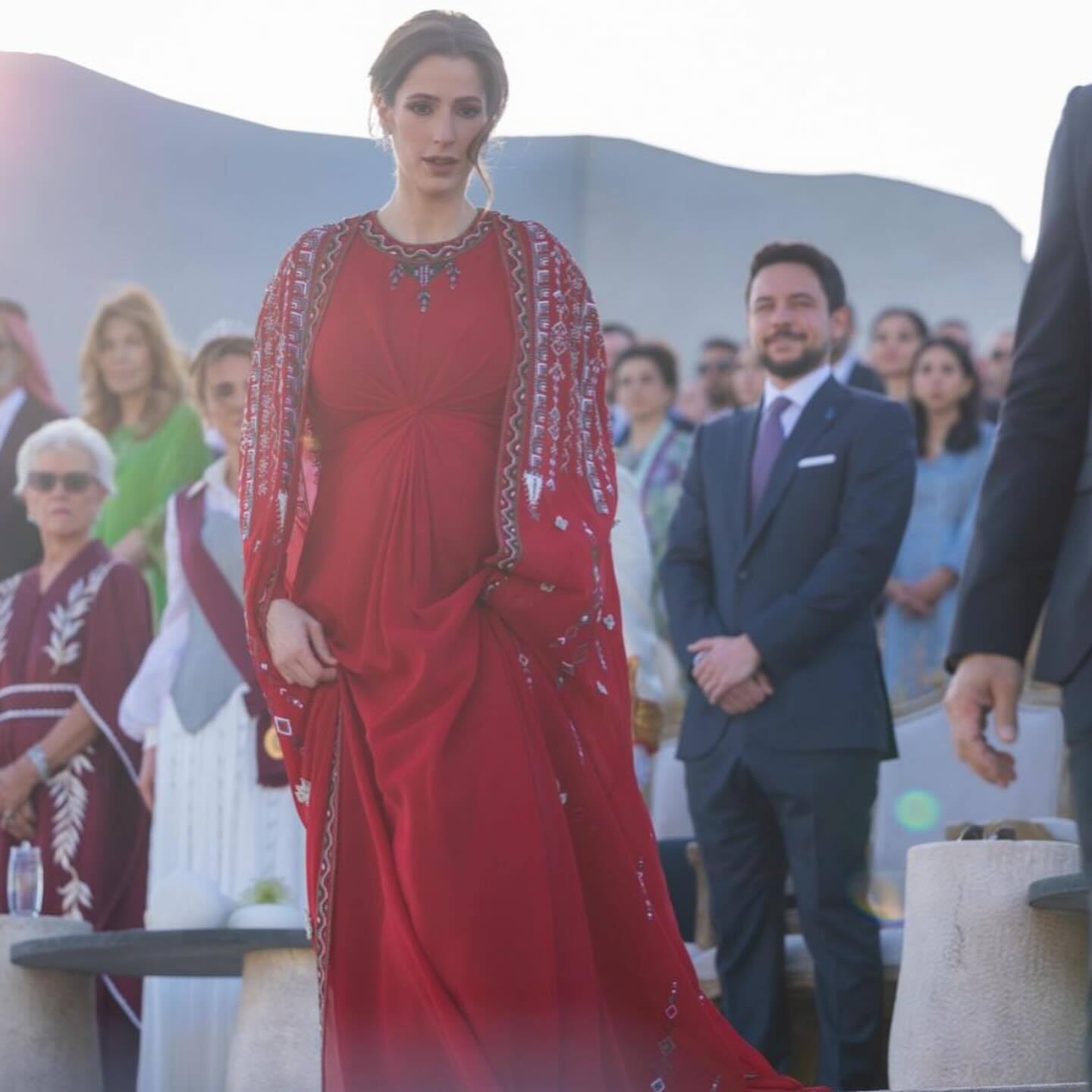 Pregnant Princess Rajwa of Jordan makes a public appearance in her new status for the first time: the stunning red dress was made to order