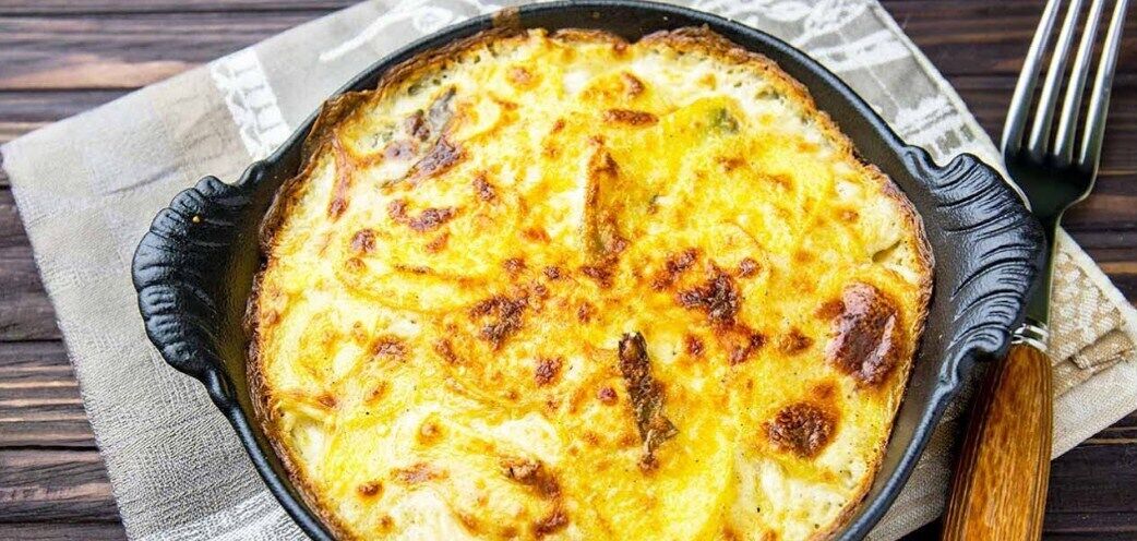 Potato casserole with cheese in the oven