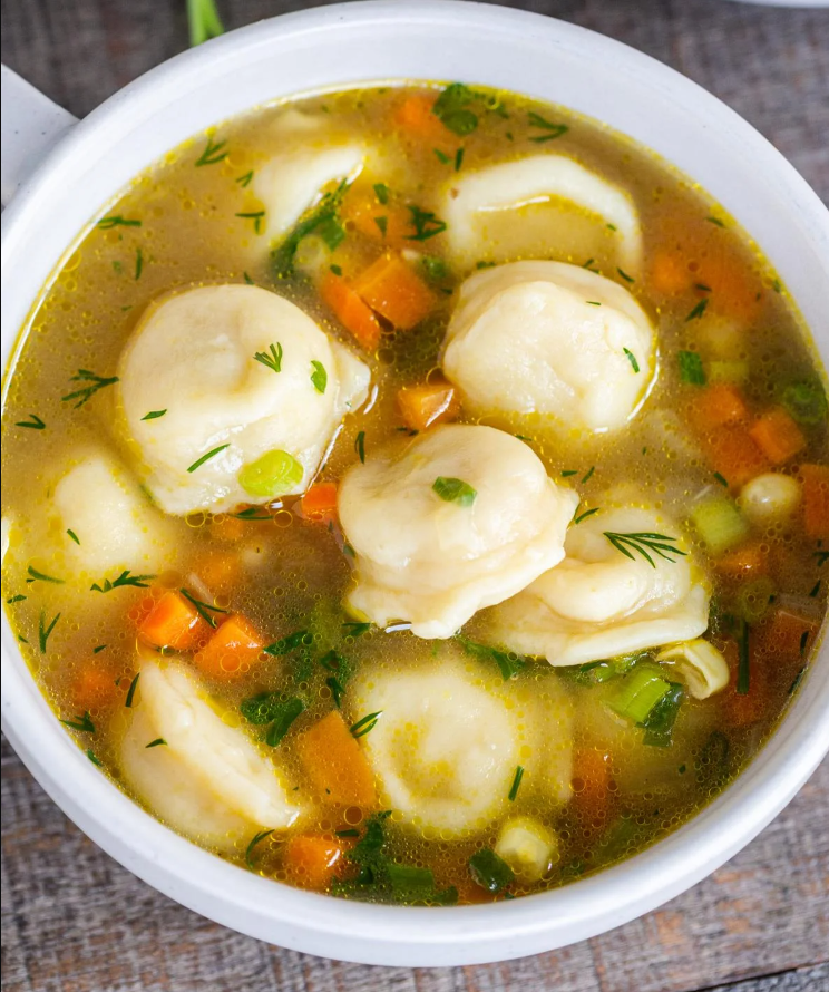 Soup with dumplings and processed cheese