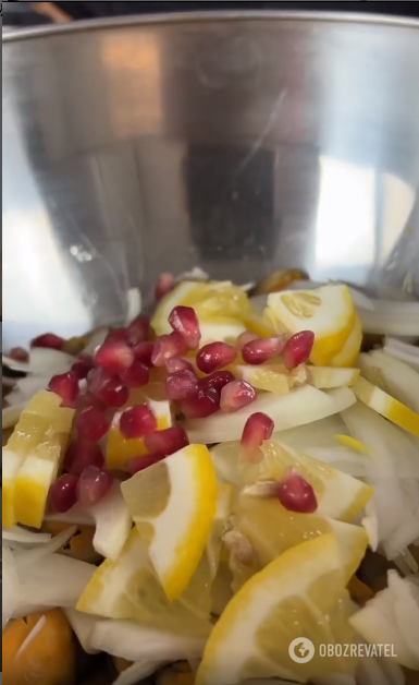 Adding lemon and pomegranate seeds to mussels