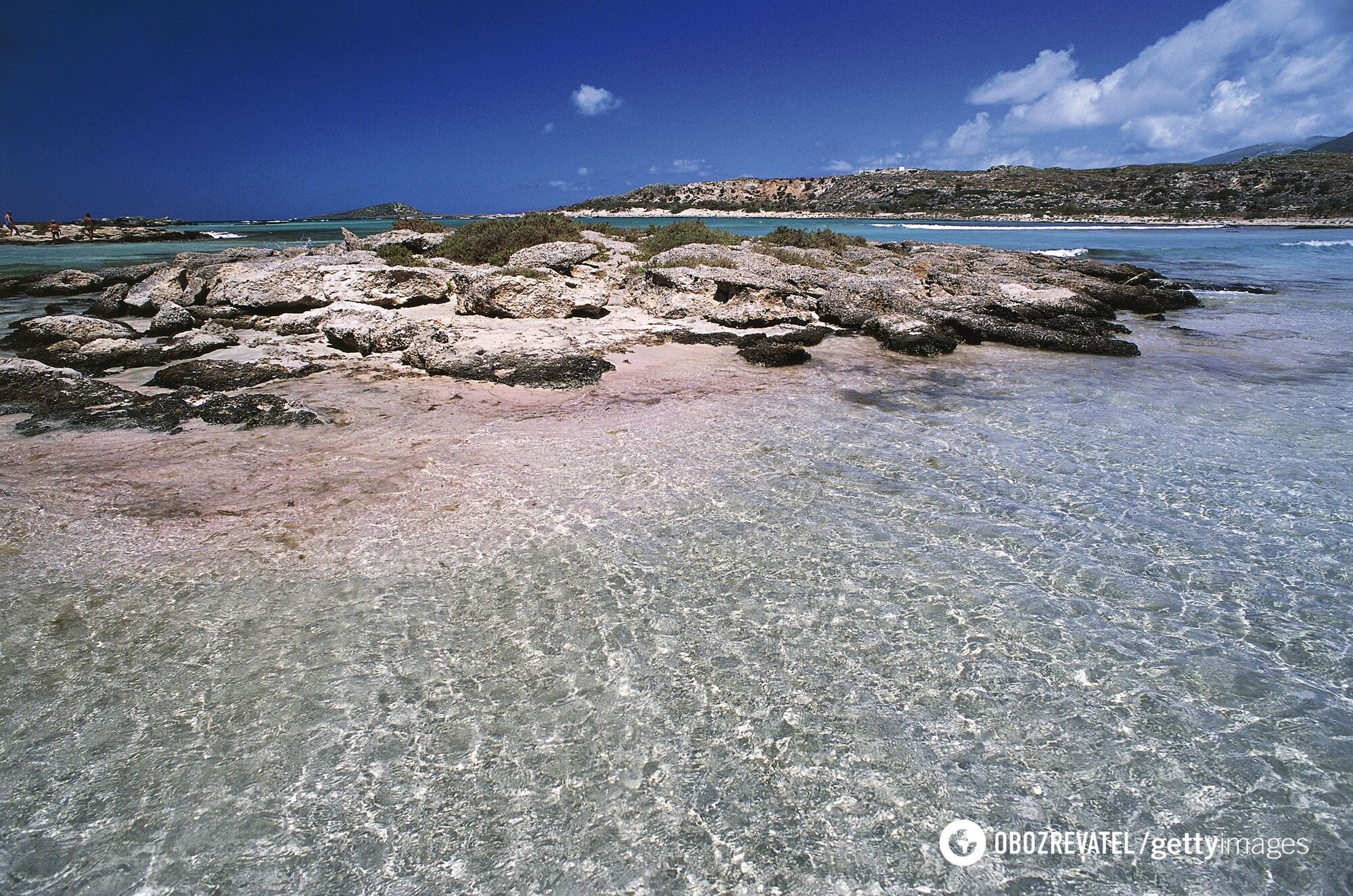 Pink sand and turquoise sea. A remote Greek beach was named one of the best in Europe