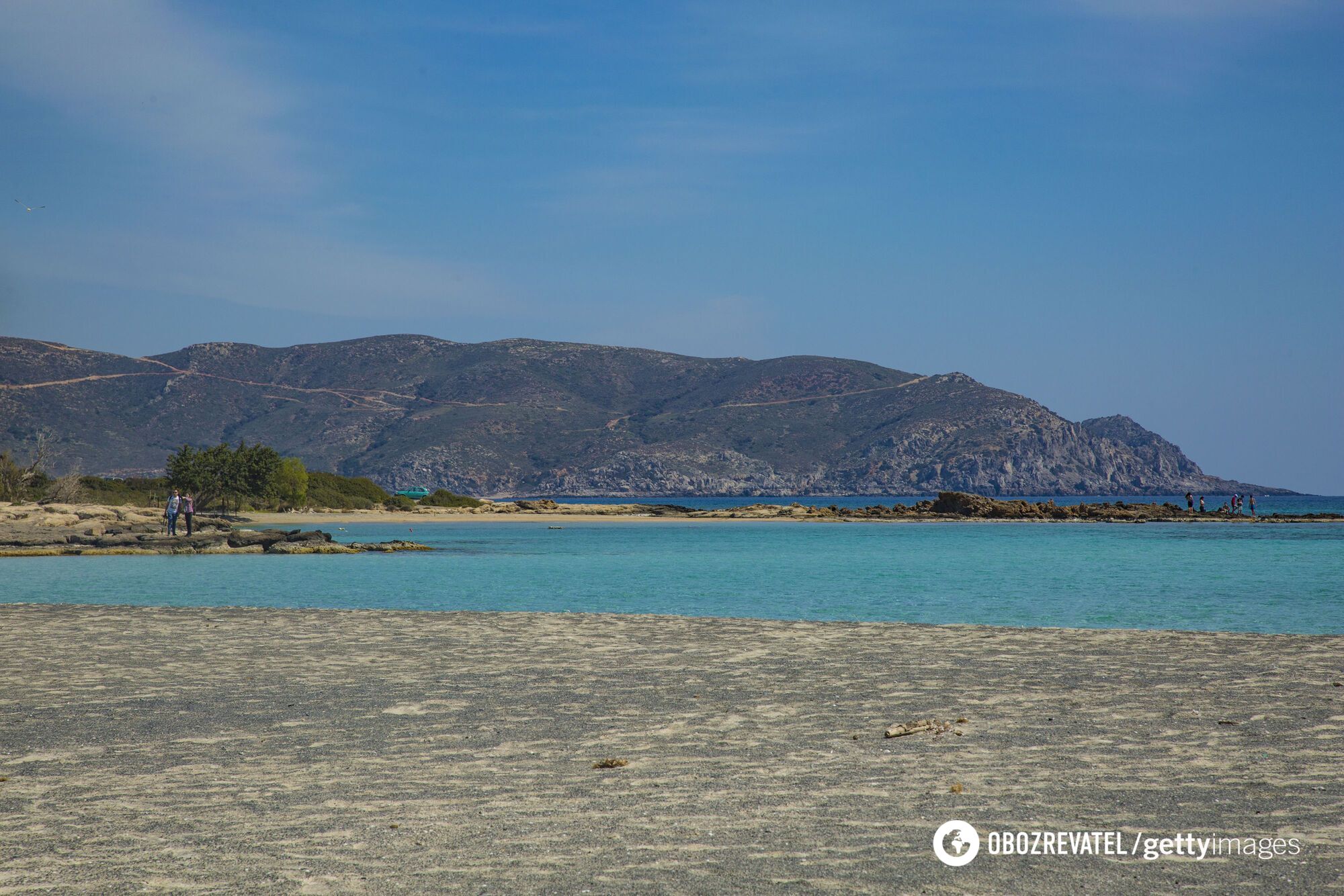 Pink sand and turquoise sea. A remote Greek beach was named one of the best in Europe