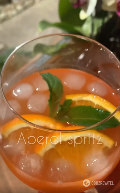 Garnishing a cocktail with mint