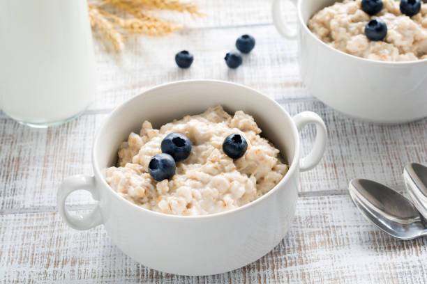 Healthy wheat porridge with milk for breakfast