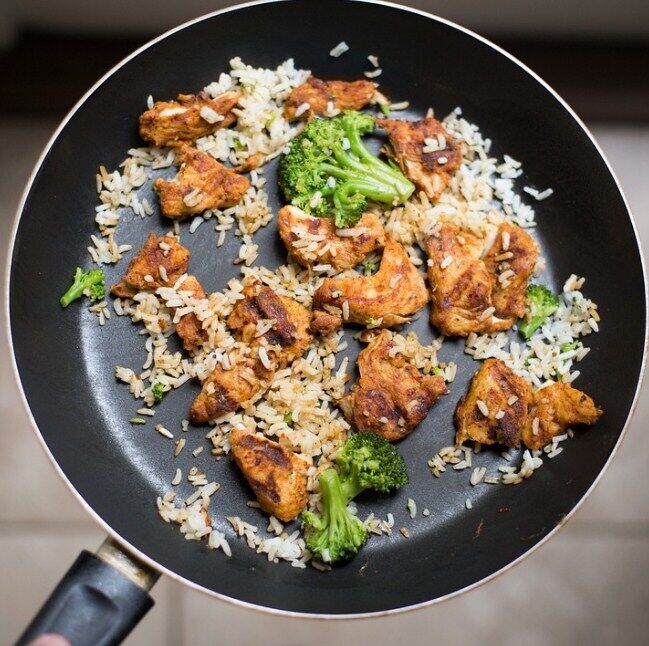 Teriyaki chicken with rice and vegetables in a pan