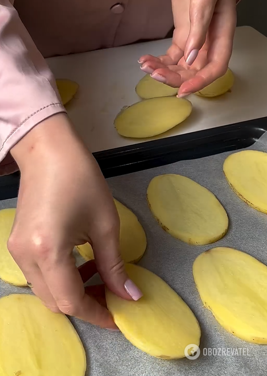 You've never baked potatos like this before: sliced and topped with cheese