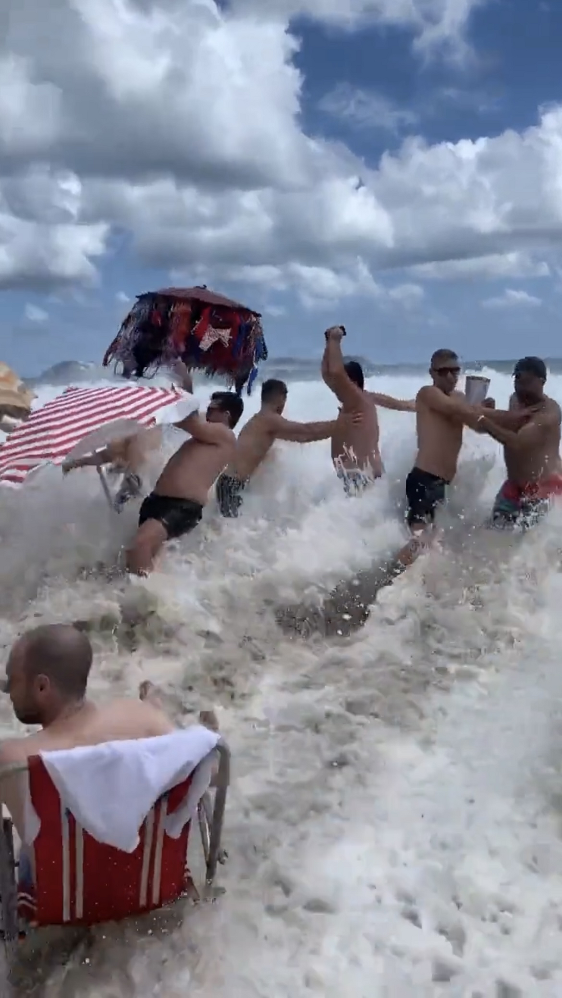 A giant killer wave washed away tourists and sunbeds on a beach in Brazil. Video