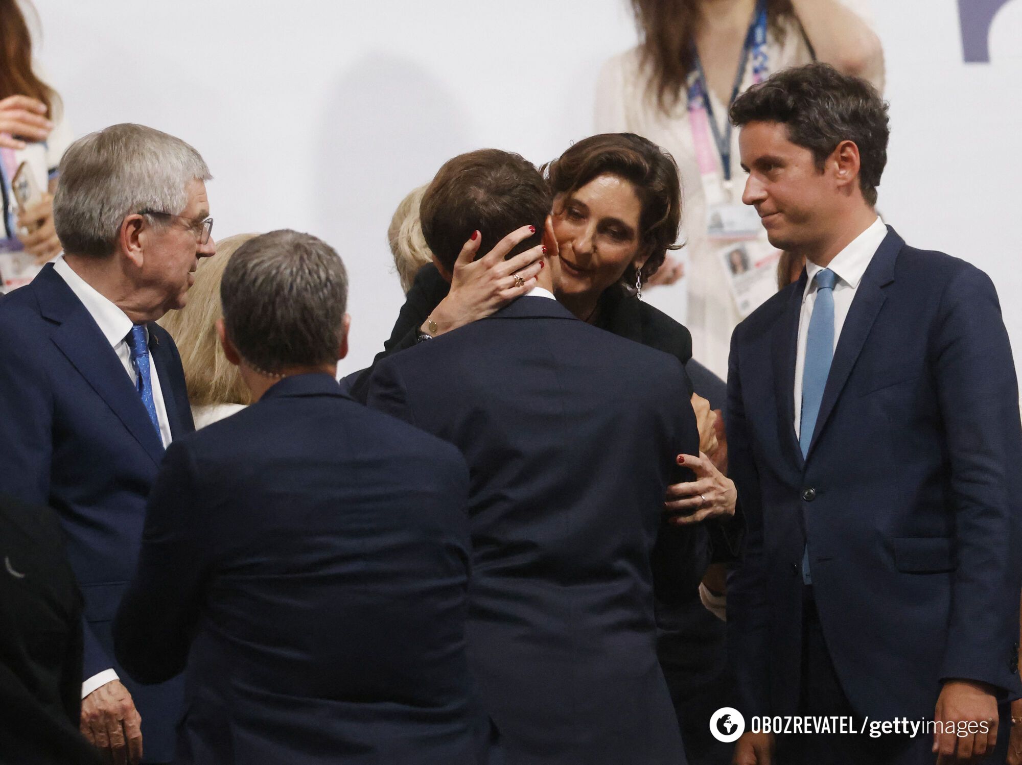 A photo of French President Emmanuel Macron and the Minister of Sports kissing went viral: his wife was standing nearby