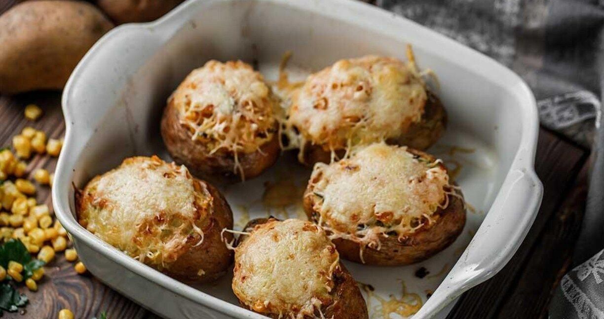 Baked potatoes with stuffing and cheese