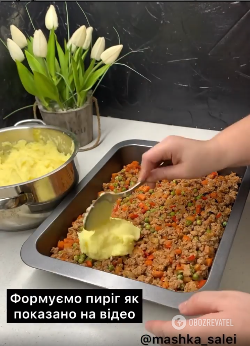 Putting the potatoes on the meat.