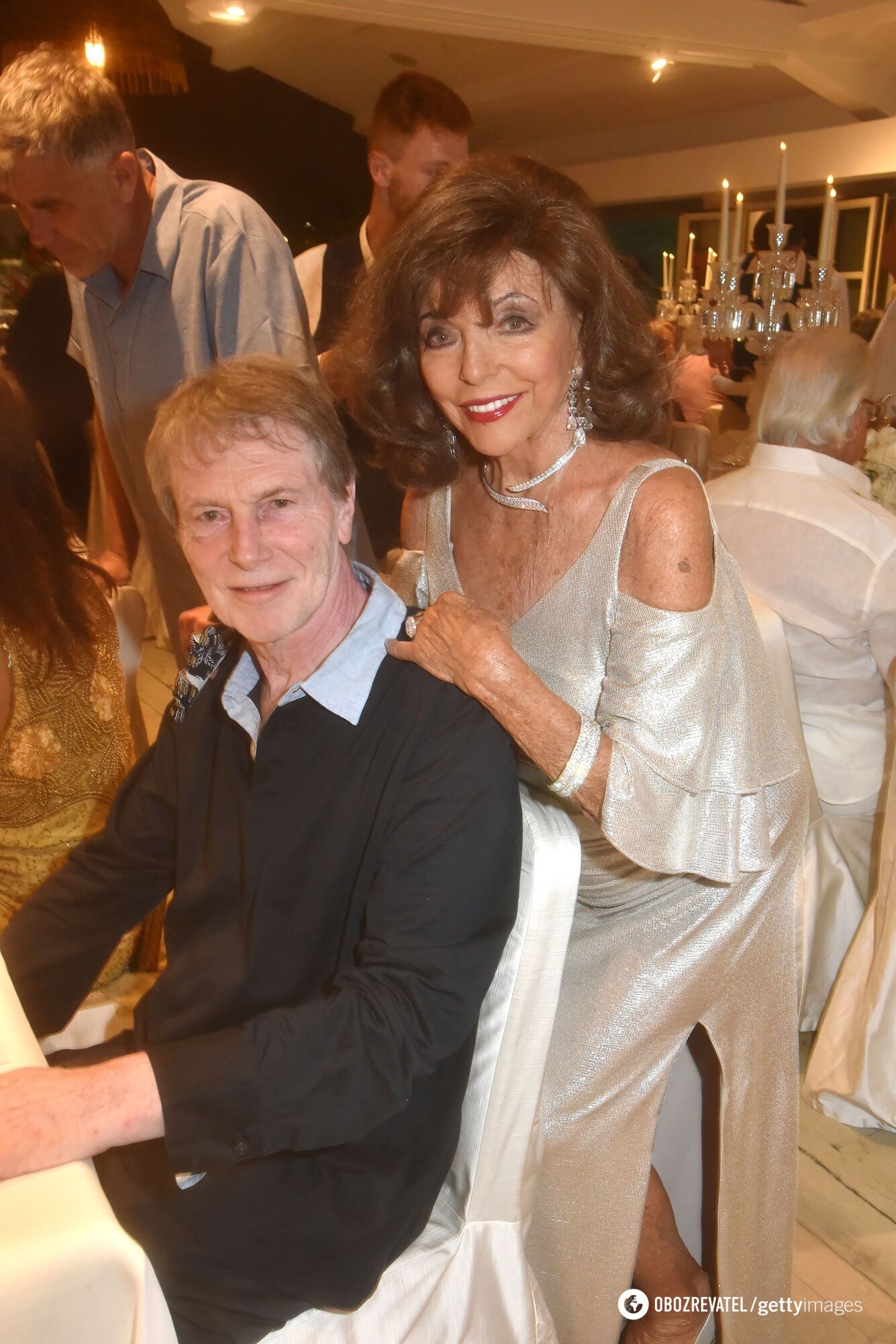 The ''Dynasty'' star went public in a daring dress: how 91-year-old Joan Collins looks, who charmed 32 years younger man. Photo