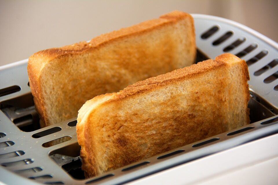 The dish is served on fried toast or buns