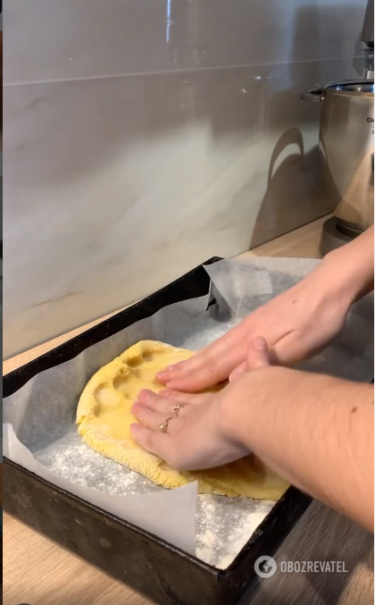 Putting the dough in a mold.