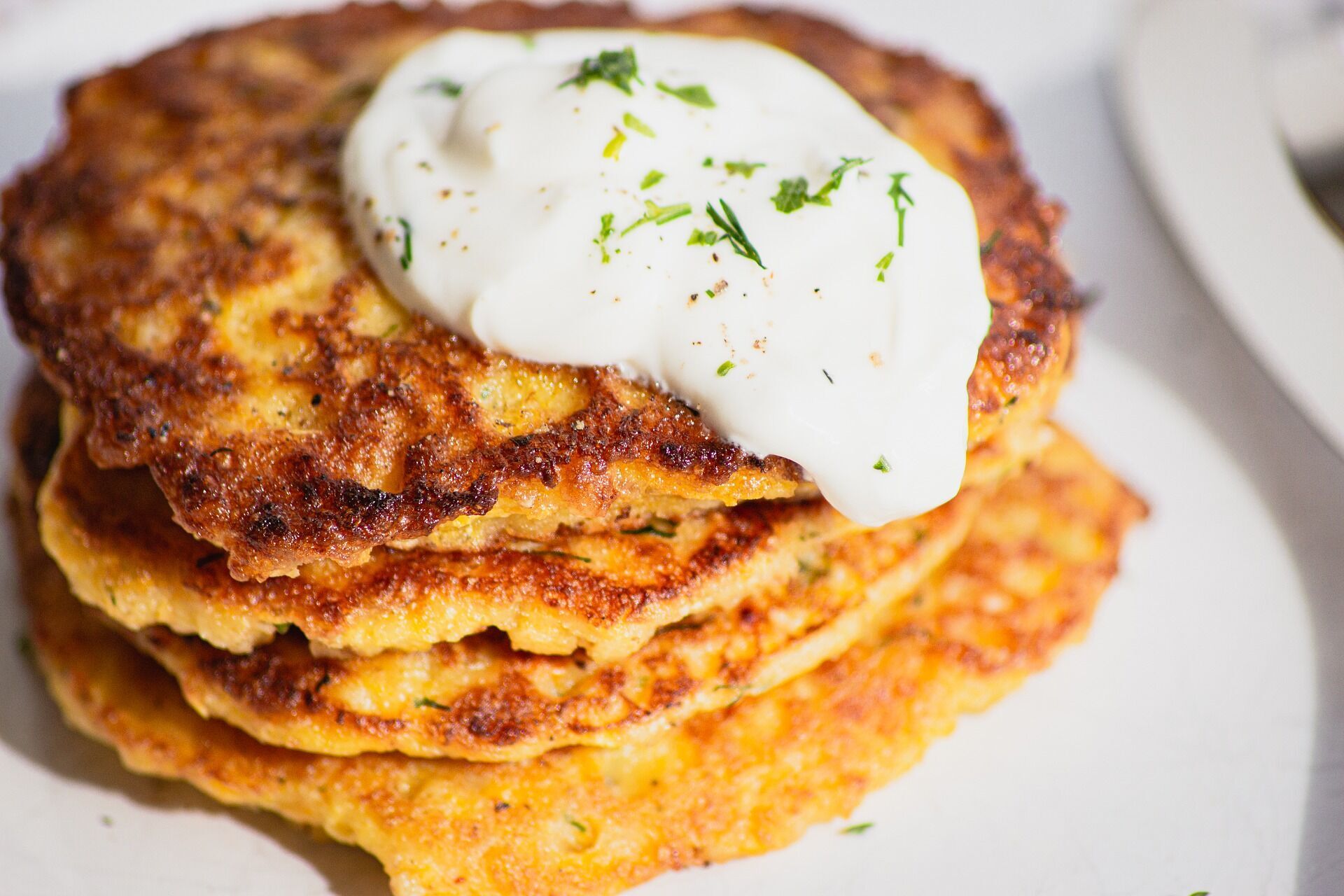 Cabbage pancakes with sour cream