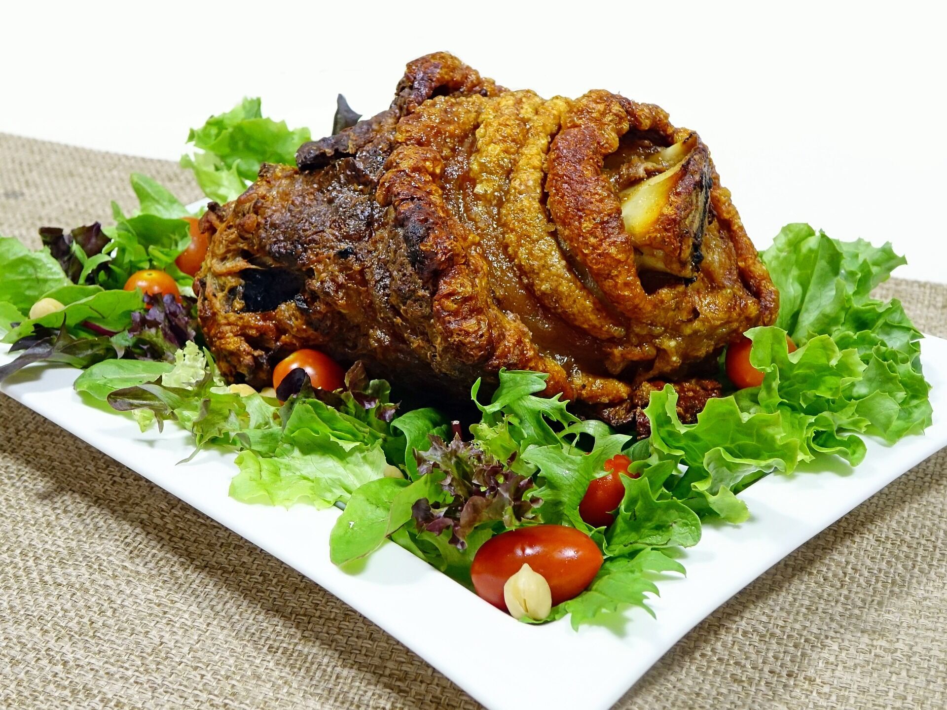 Pork knuckle with vegetables.