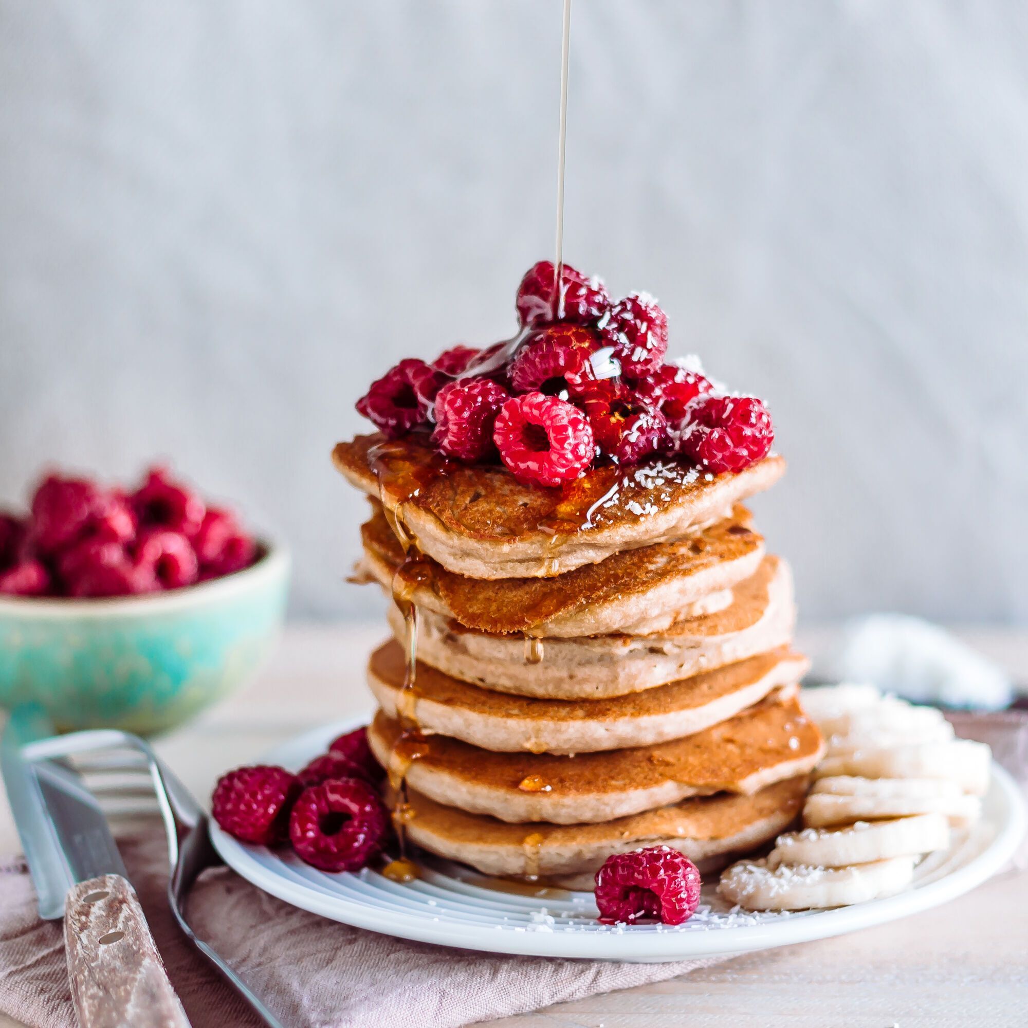 Pancakes topped with raspberries.